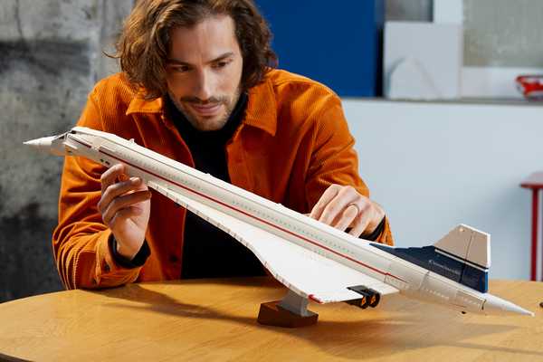 Man holding the new LEGO® Icons Concorde supersonic aeroplane set.